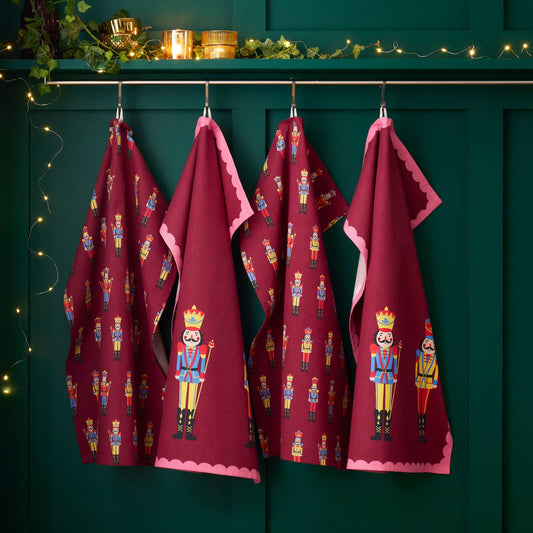 catherine-lansfield-christmas-nutcracker-cotton-kitchen-tea-towel-plum